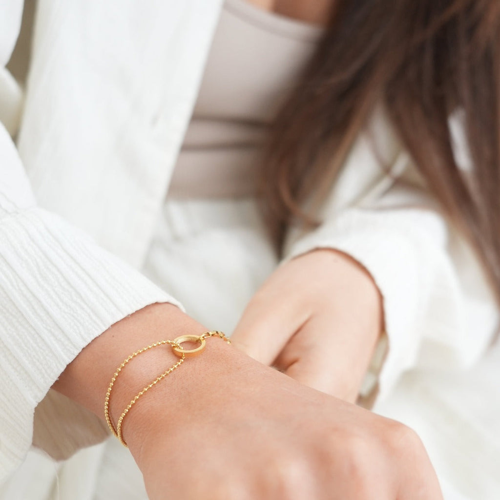 Orin Curve Sculpted Bracelet in gold-tone, close-up detail view