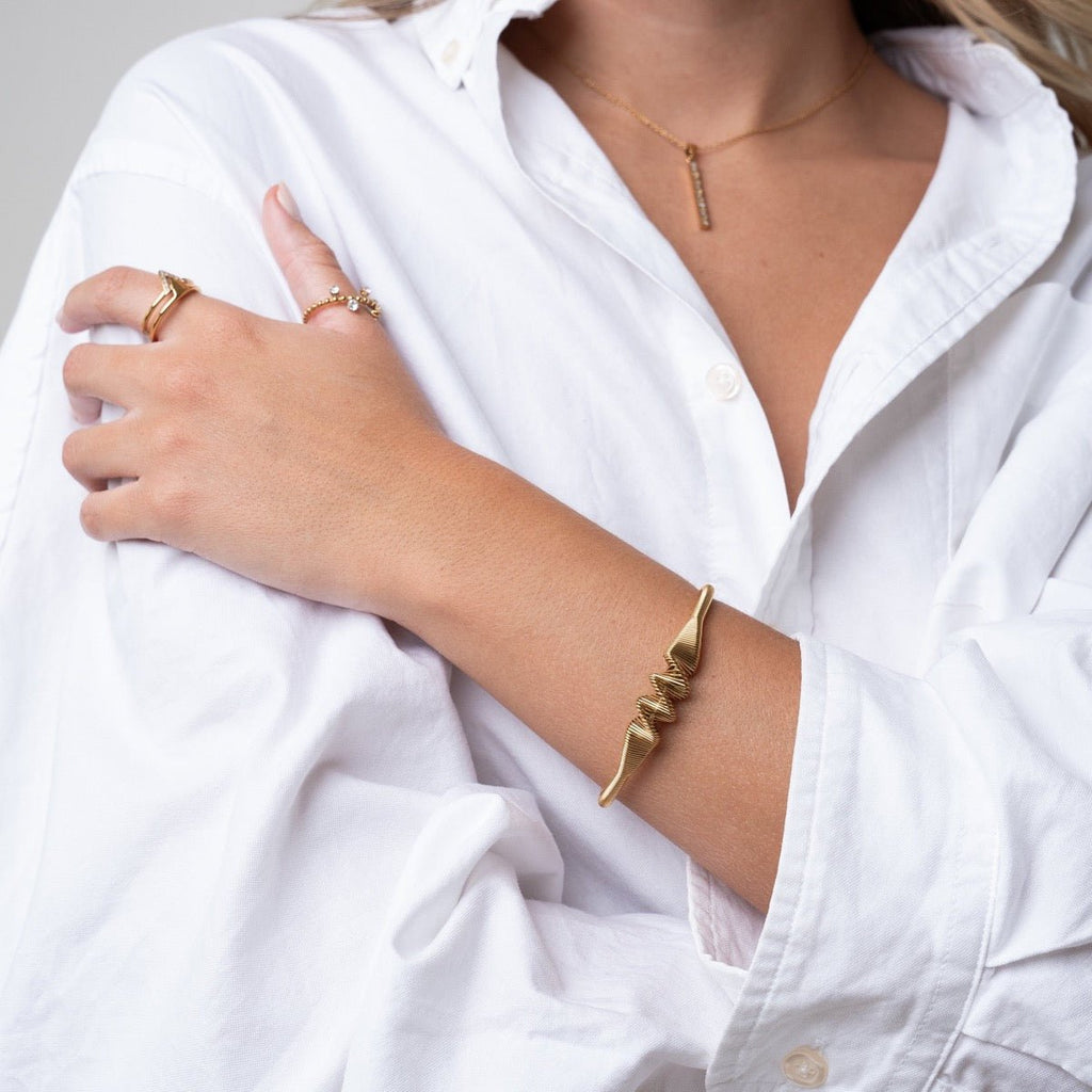 Lior Drift Wave Bracelet in gold-tone, close-up detail view