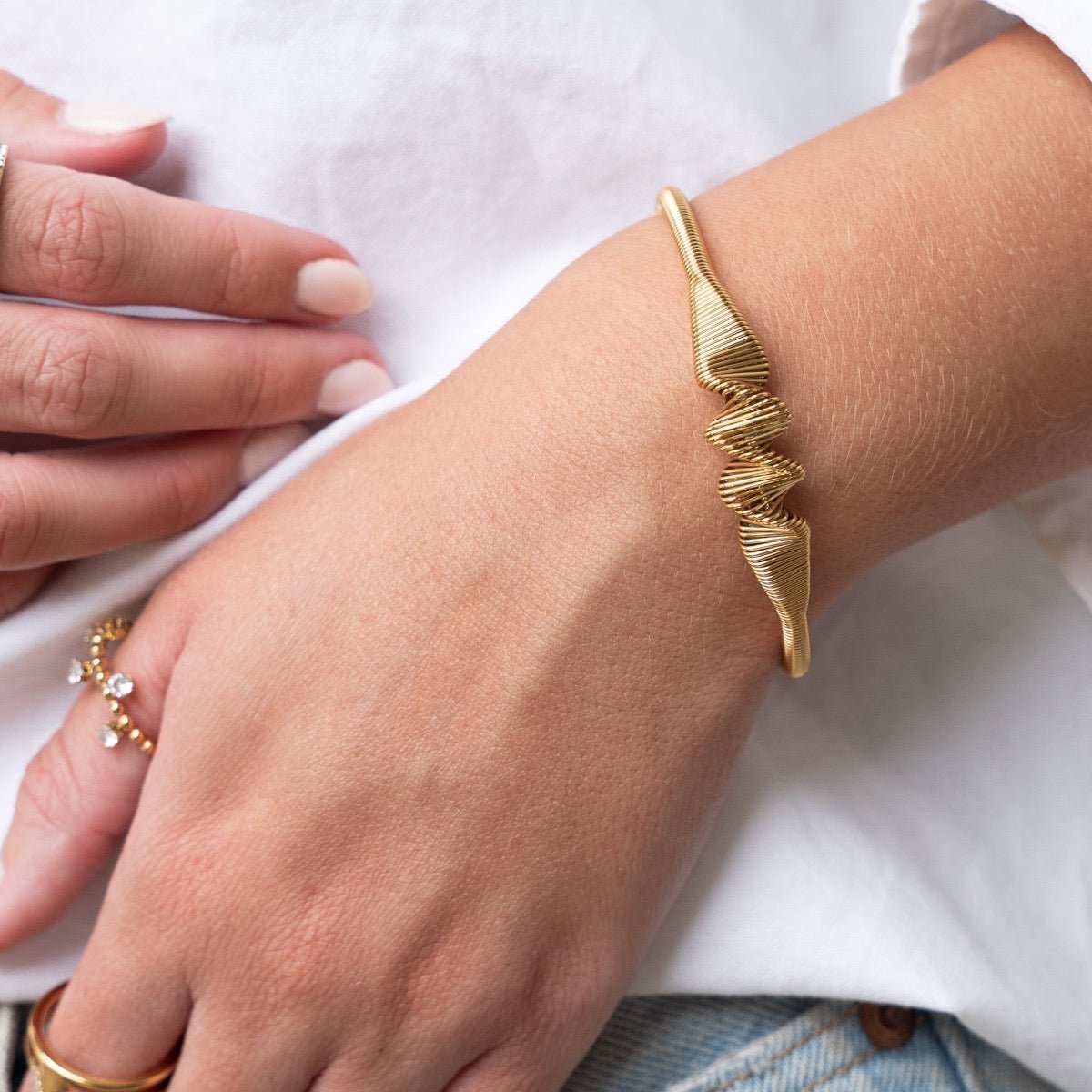 Lior Drift Wave Bracelet in gold-tone, side profile view