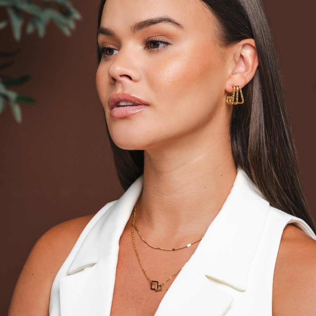 Serein Drift Sculpted Earrings in gold-tone, styled product view