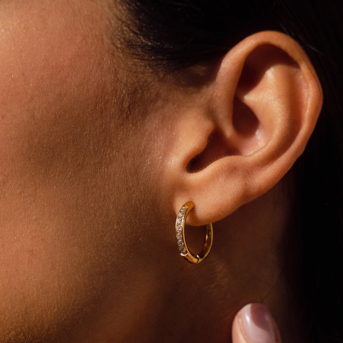 Oriel Crest Hoop Earrings in gold-tone, close-up detail view