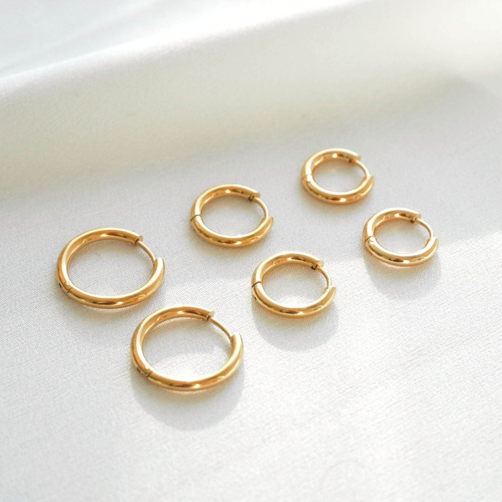 Nacre Beam Hoop Earrings in gold-tone, styled product view