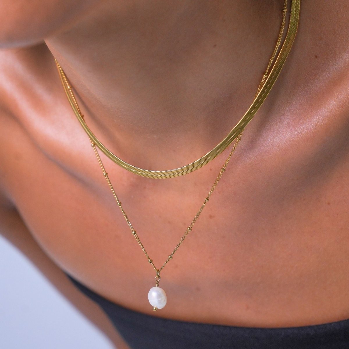 Nacre Fold Light Accent Necklace in gold-tone, close-up detail view