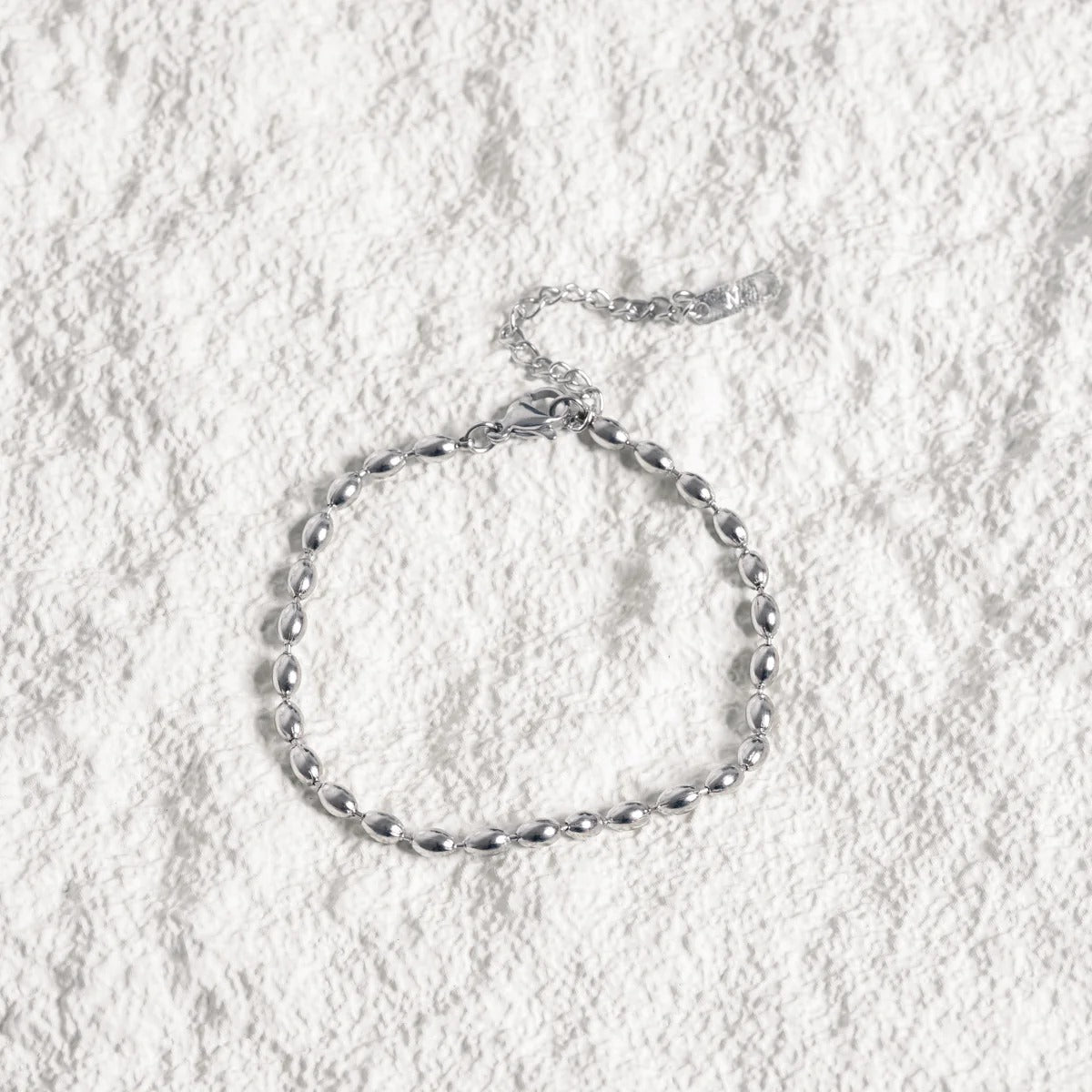Nori Fold Chain Link Bracelet in silver-tone, close-up detail view